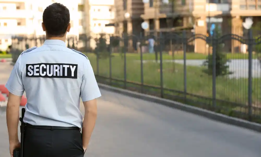Freddy world security officer standing in school campus in Boston MA