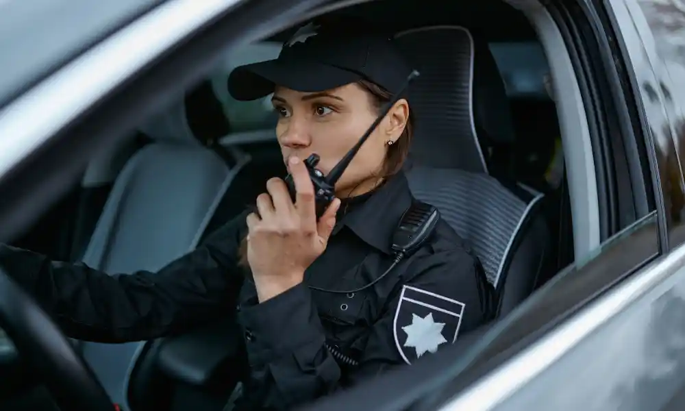 Security guard in vehicle providing mobile patrol service in Boston, MA